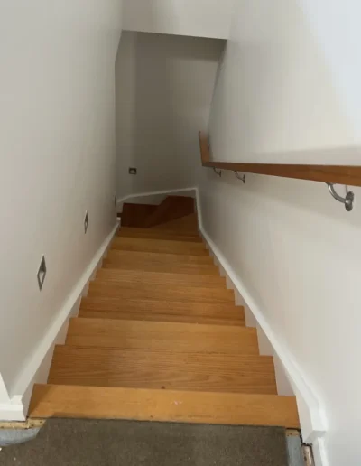 Professional residential painting project featuring freshly painted walls, trims and stairwell completed by Power Brush Painting.